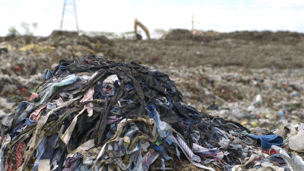 Clothing waste in a landfill from the film.